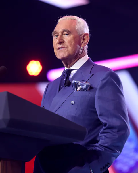 Roger Stone speaking at a public event in 2025.